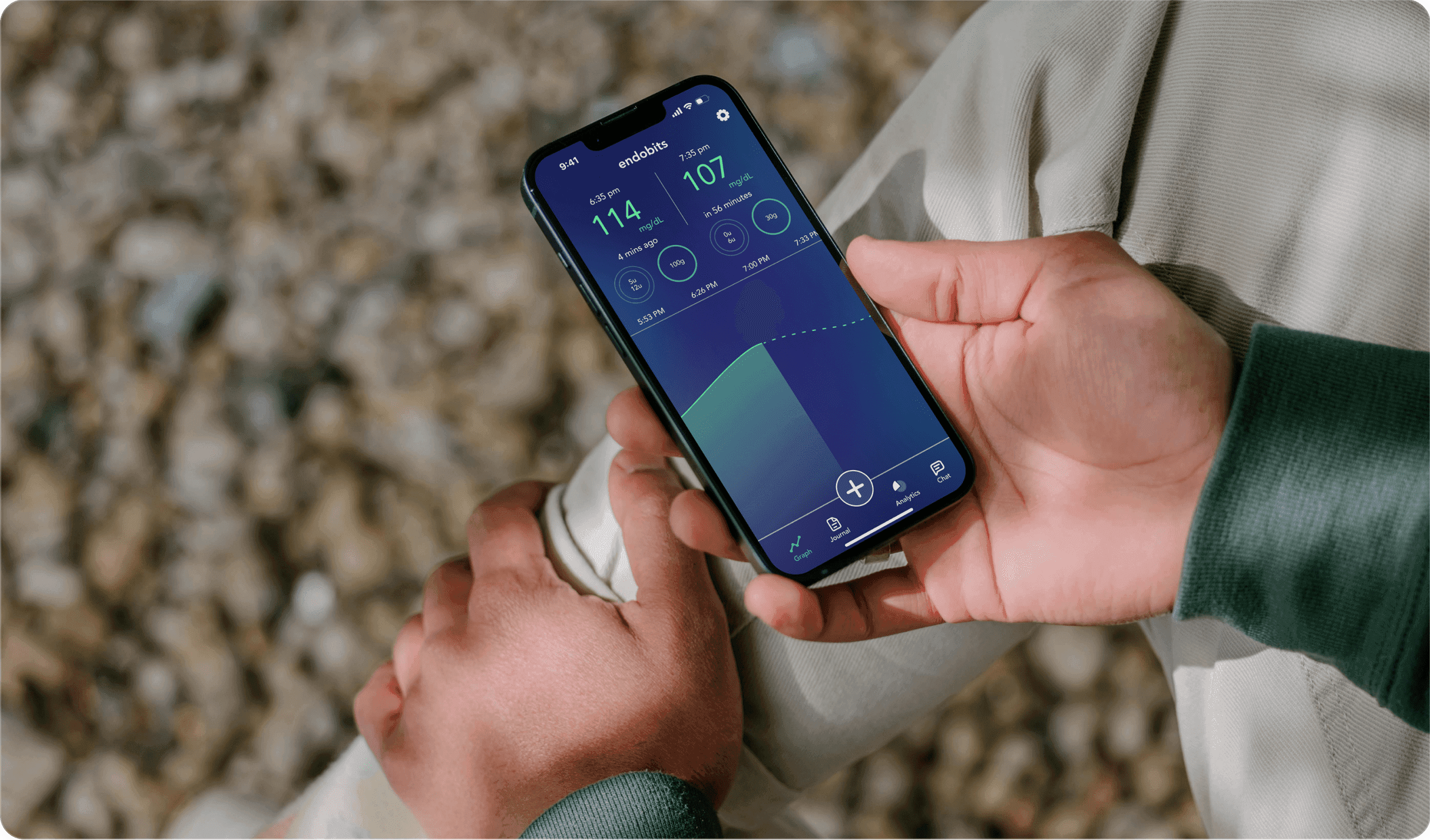 Holding phone with Endobits Companion App